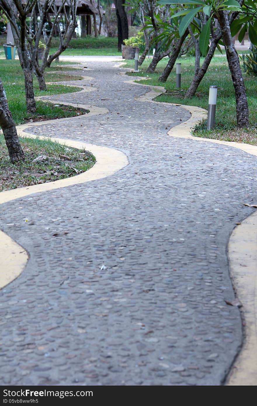 Curved Rock Road resort walk way green tree