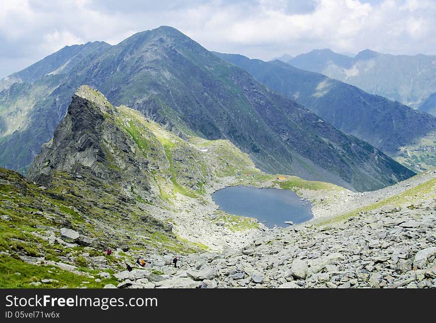 Over the clouds - view from Mount Negoiu of Caltun Lake, Fagaras Mouintains. Over the clouds - view from Mount Negoiu of Caltun Lake, Fagaras Mouintains.