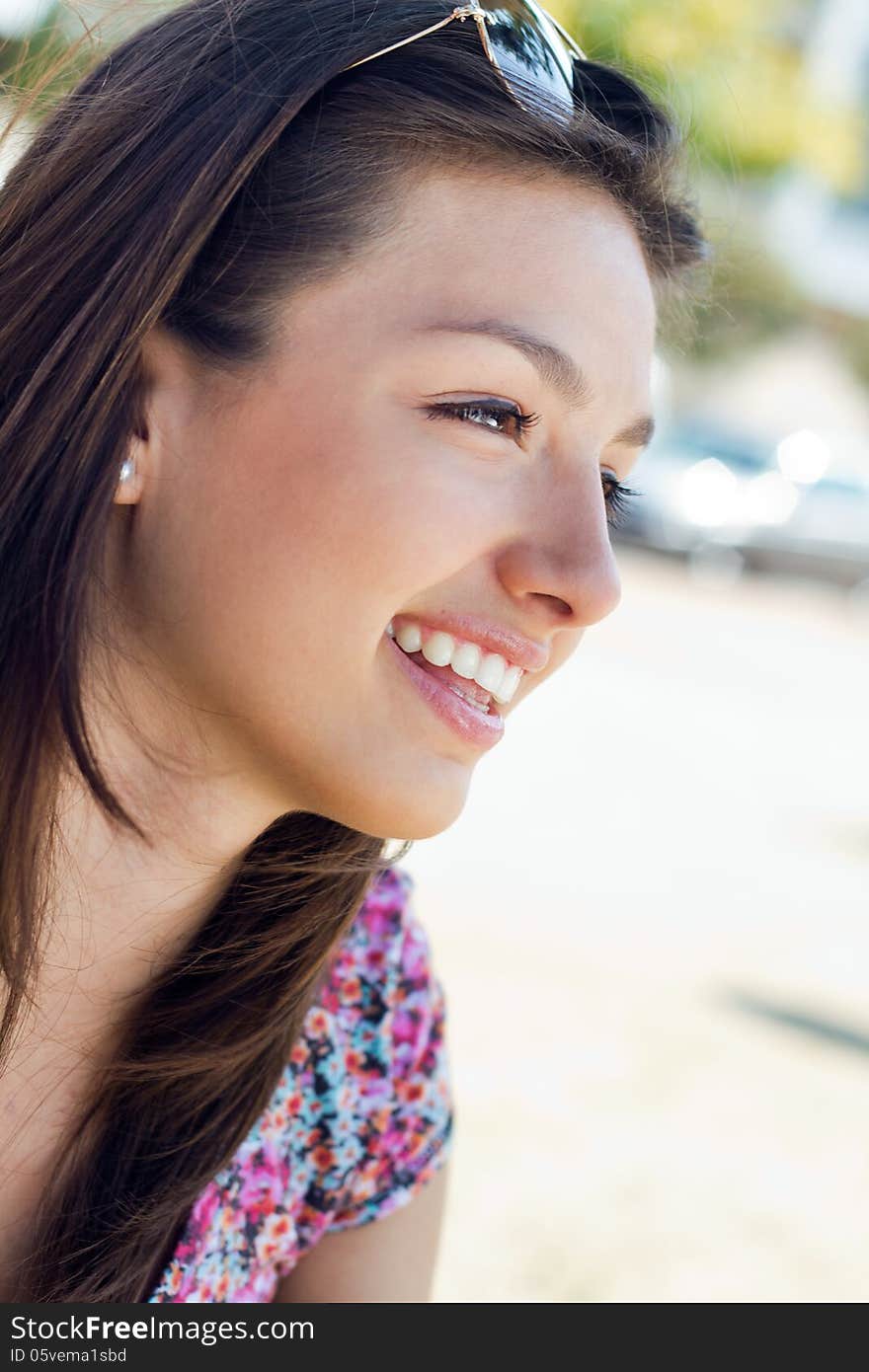 Portrait of beautiful happy girl at the park