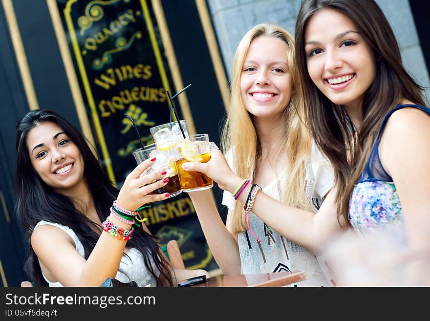 Friends taking a drink on a terrace