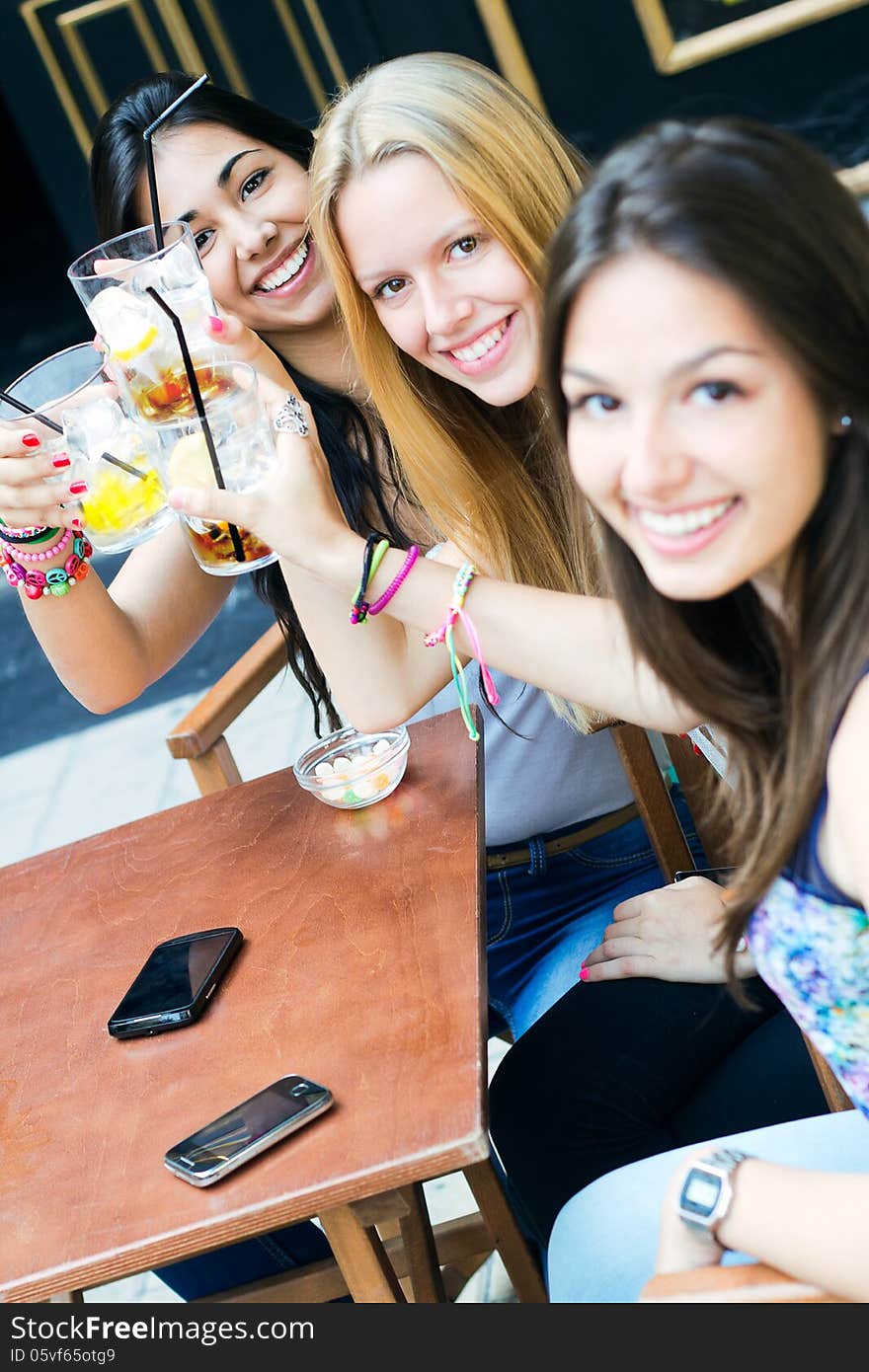 A group of friends taking a drink on a terrace