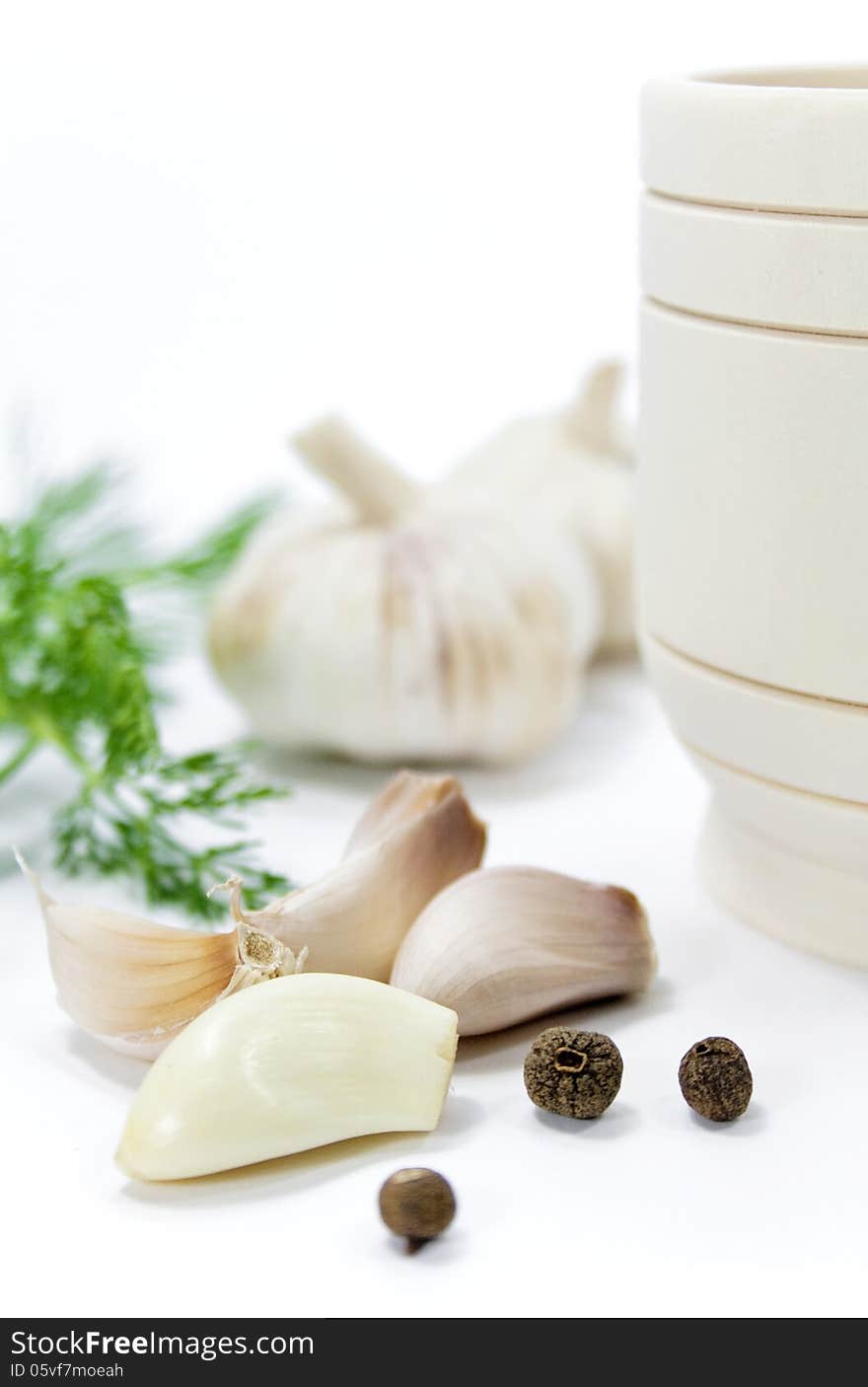 Garlic and pepper on a white background