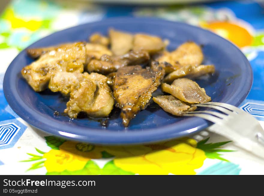 Pork fries on blue dish