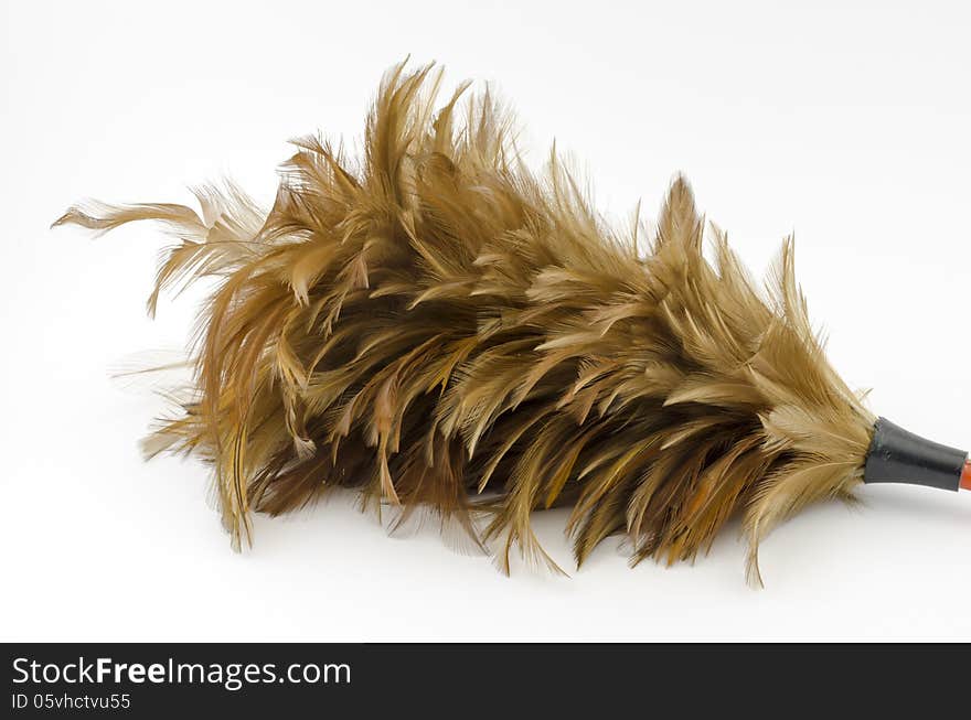 Feather broom isolated on white background