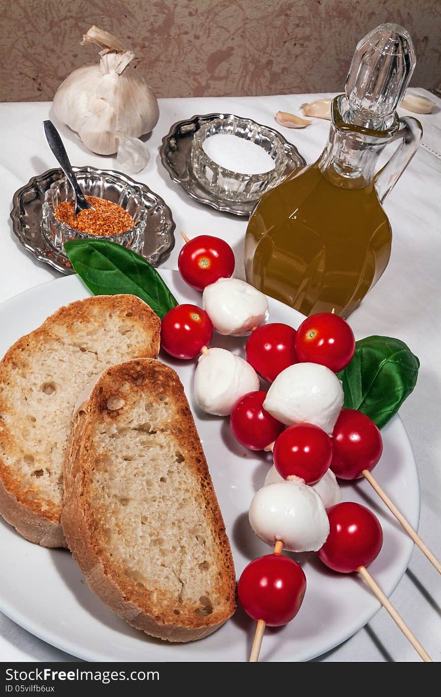 Bread, garlic, basil and olive oil for simple italian bruschetta