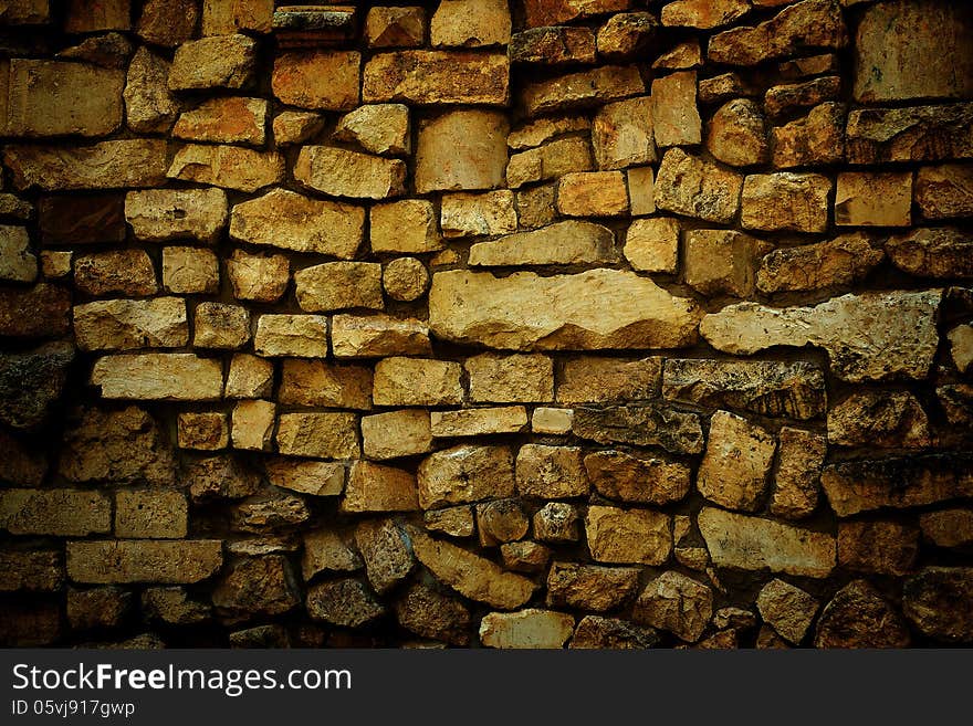 Wall made ​​of natural stone. Wall made ​​of natural stone