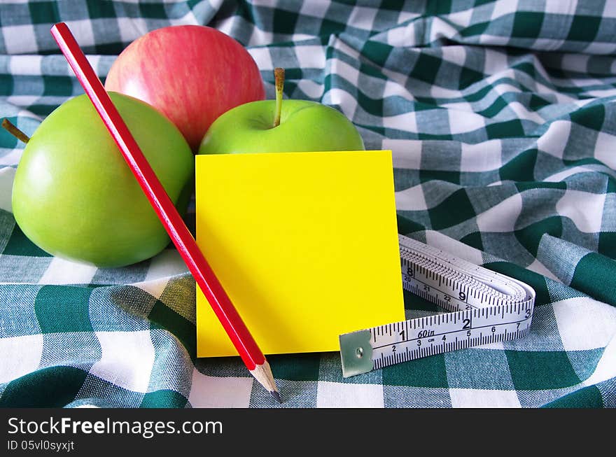 Apples measuring tape and note pad. Apples measuring tape and note pad