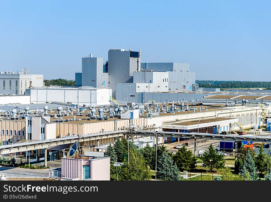 The factory is photographed against the blue sky