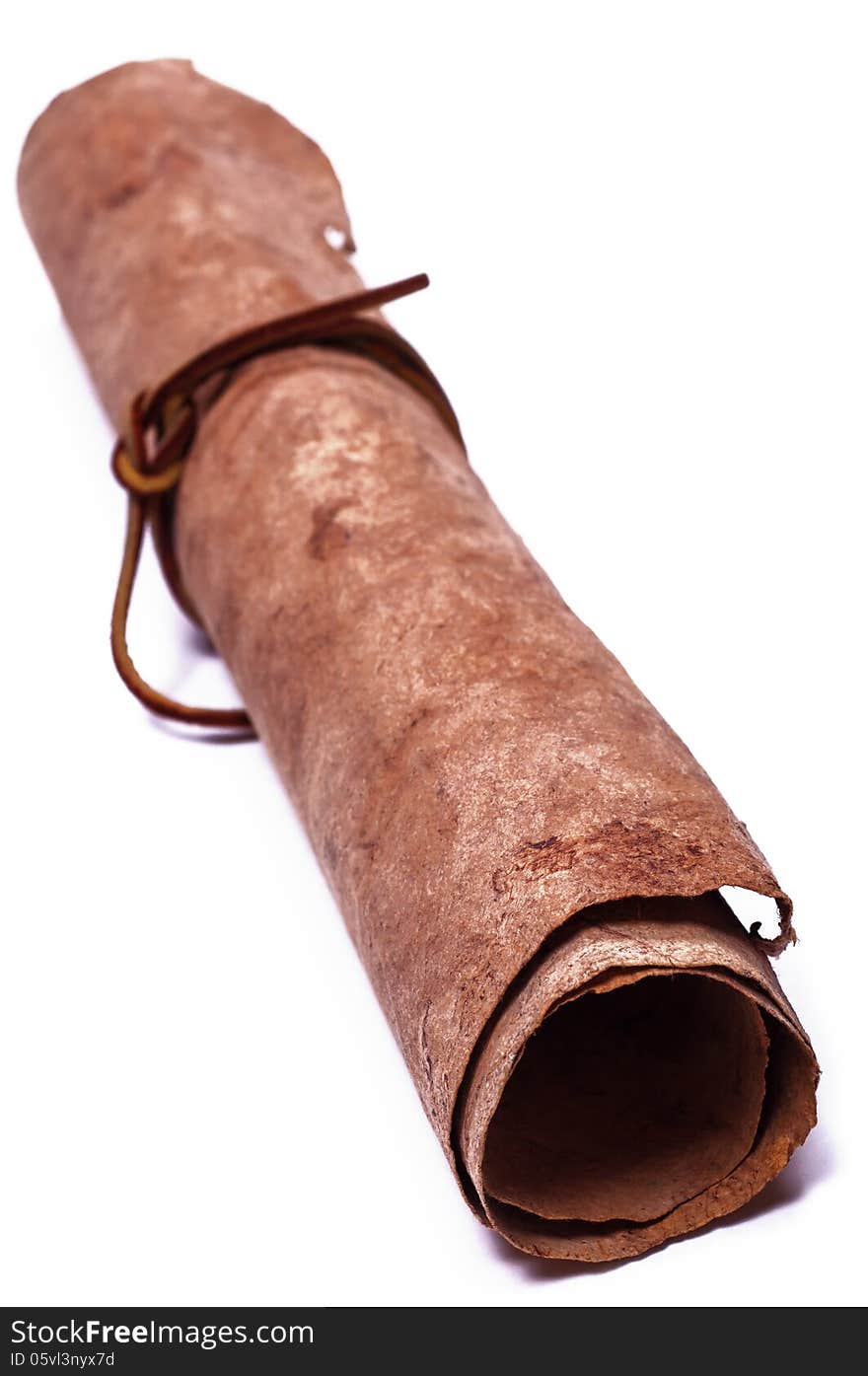 Roll of old parchment. Close-up. Isolated on white background. Roll of old parchment. Close-up. Isolated on white background.