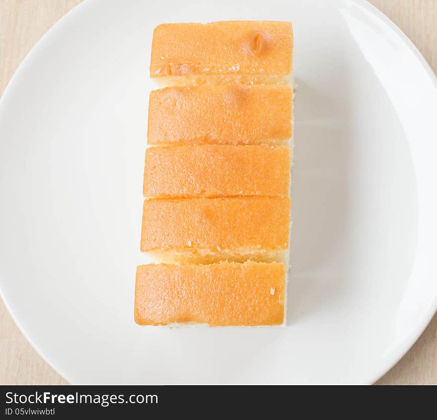 Butter cake sliced on dish. Butter cake sliced on dish