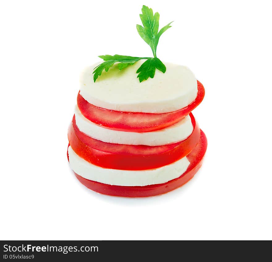 Mozzarella and tomato slices arranged in stack isolated over white. Mozzarella and tomato slices arranged in stack isolated over white