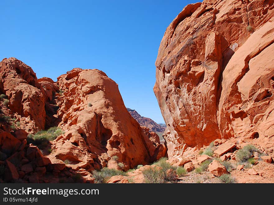 Redstone is on the North Shore Drive in Lake Mead NRA. It is about 40 miles outside of Las Vegas, about 20 miles past the Callville Bay cutoff and about 10 away from the Echo Bay junction. Hiking is available through this heavily eroded fossilized sand dunes which dates back to the Jurassic Period about 120 million years ago. Redstone is on the North Shore Drive in Lake Mead NRA. It is about 40 miles outside of Las Vegas, about 20 miles past the Callville Bay cutoff and about 10 away from the Echo Bay junction. Hiking is available through this heavily eroded fossilized sand dunes which dates back to the Jurassic Period about 120 million years ago.