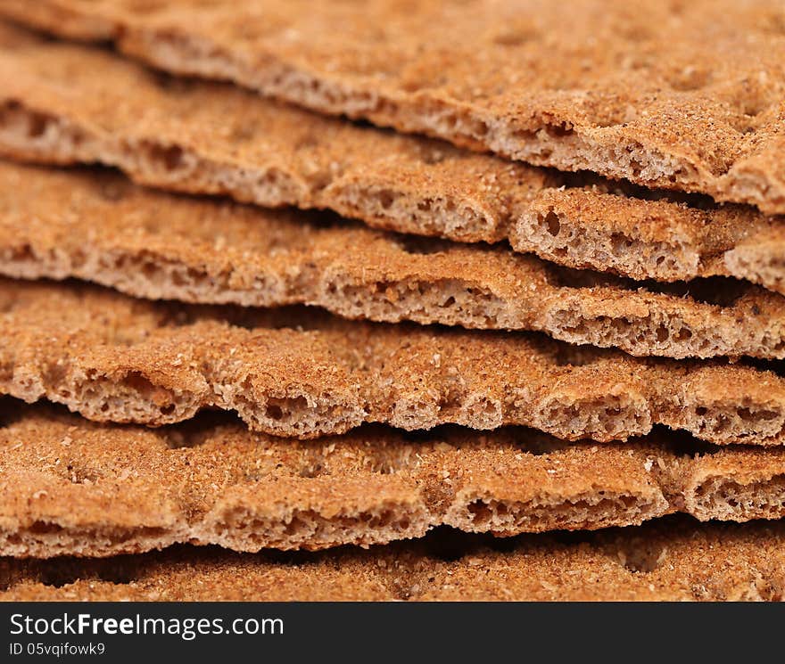 Background of bread crisps. Macro. Whole background.