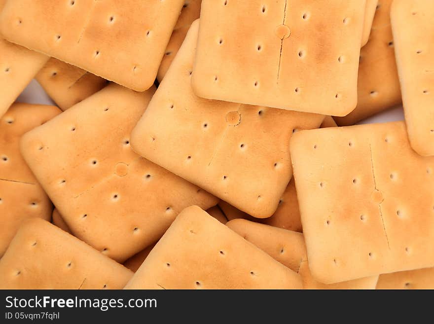 Background of stake saltine soda cracker. Macro.