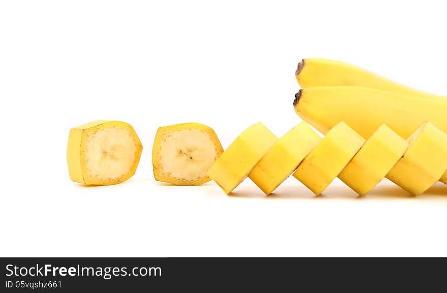 Bananas and slices on a white background