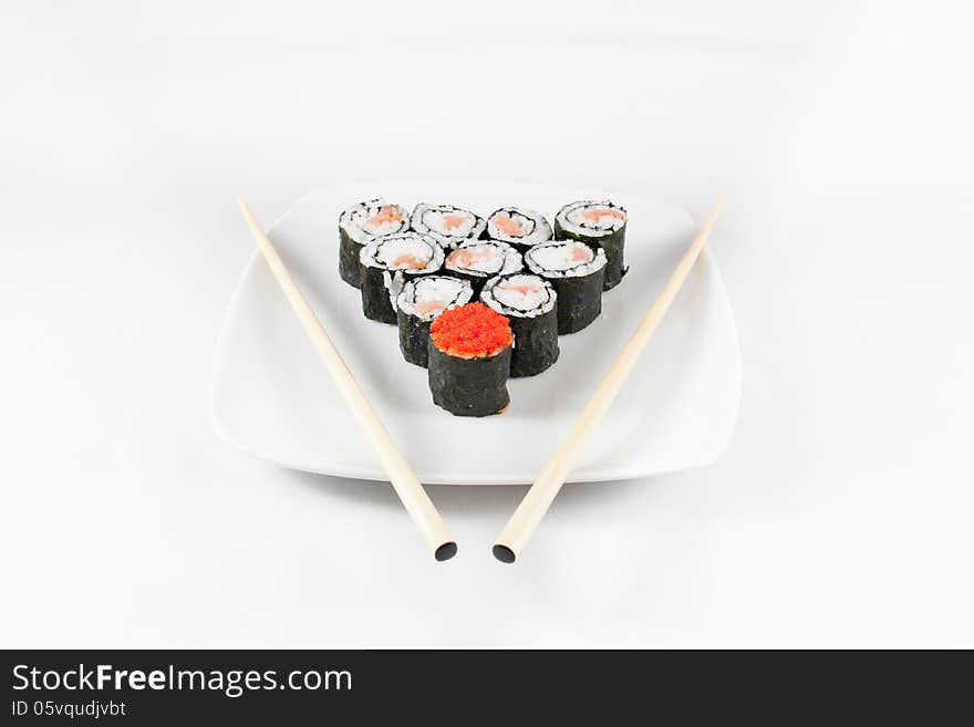 Sushi menu and chopsticks on plate, white background