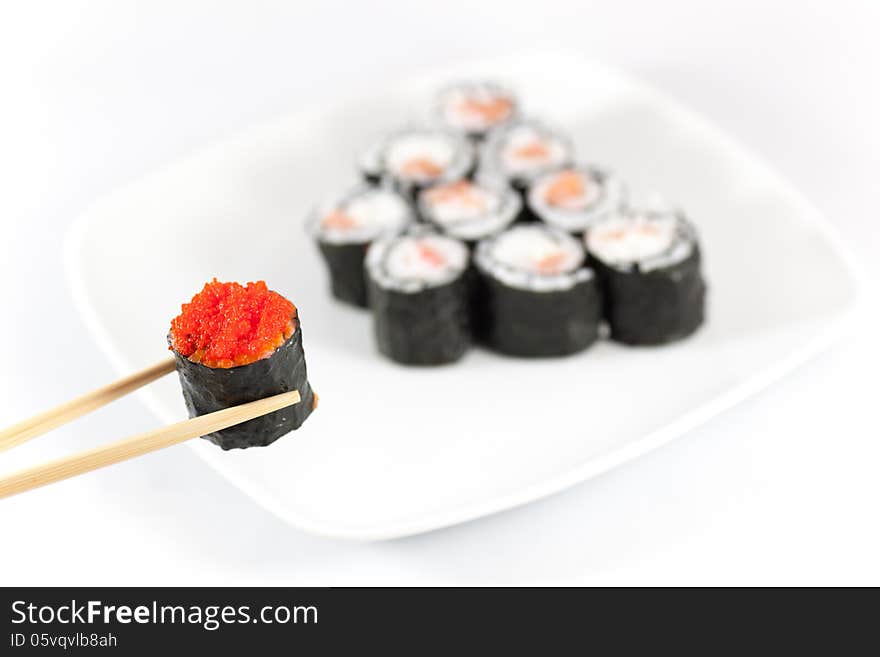 Sushi menu and chopsticks with red caviar