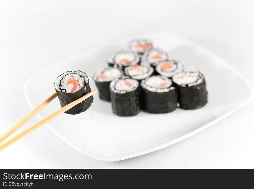 Sushi menu and chopsticks, traditional food in eastern Asia, Japan, on white background