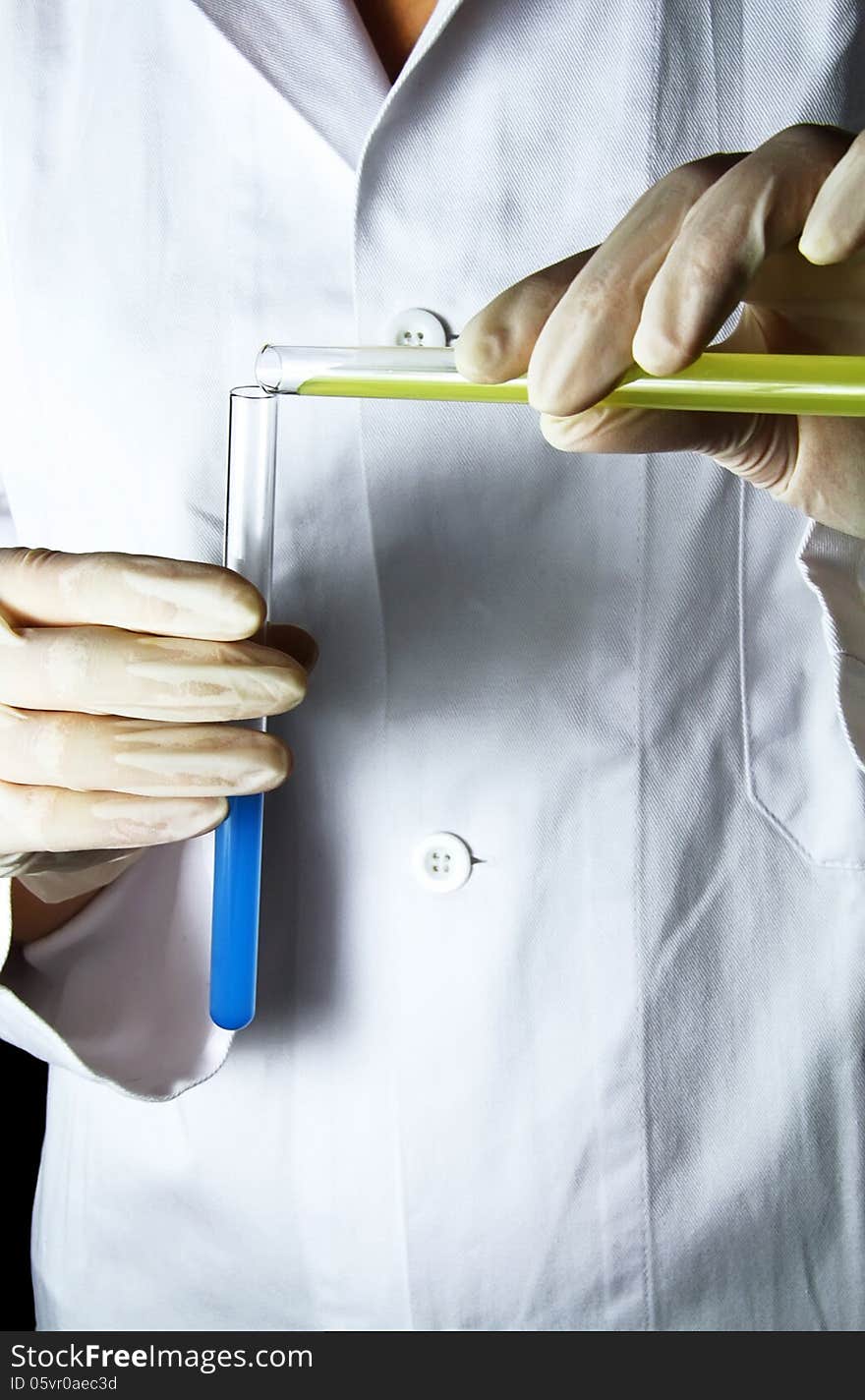 Closeup of a scientist with a test tubes.