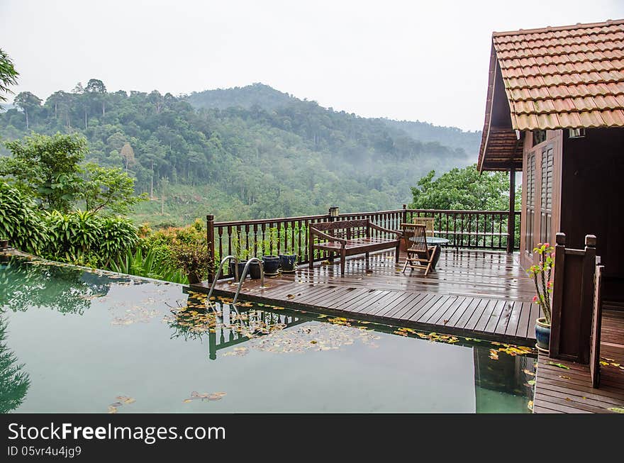 Wooden tropical resort with a pool