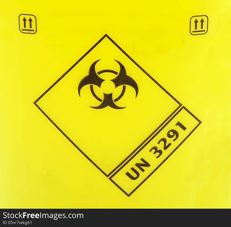 Biohazard sign on a yellow background.