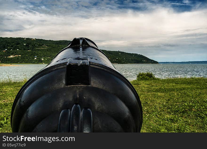 Old canon beside the Saint-Lawrence in Baie Saint-Paul near Quebec city