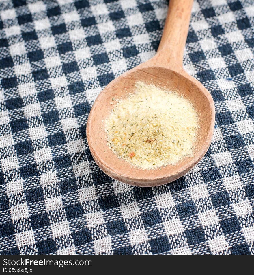 Spice in a wooden spoon, close up photo