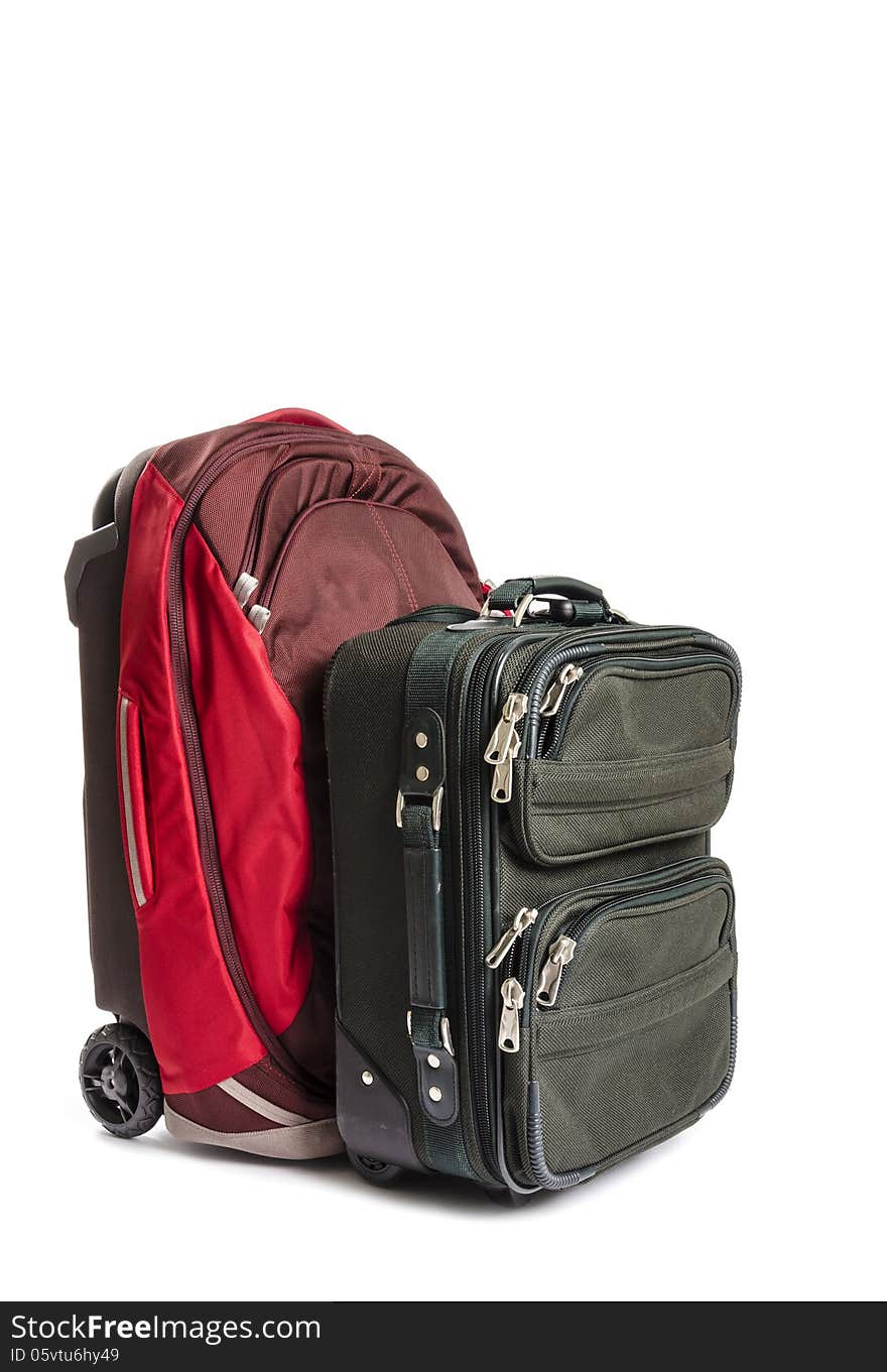 A red and green travel suitcases isolated on white. A red and green travel suitcases isolated on white.