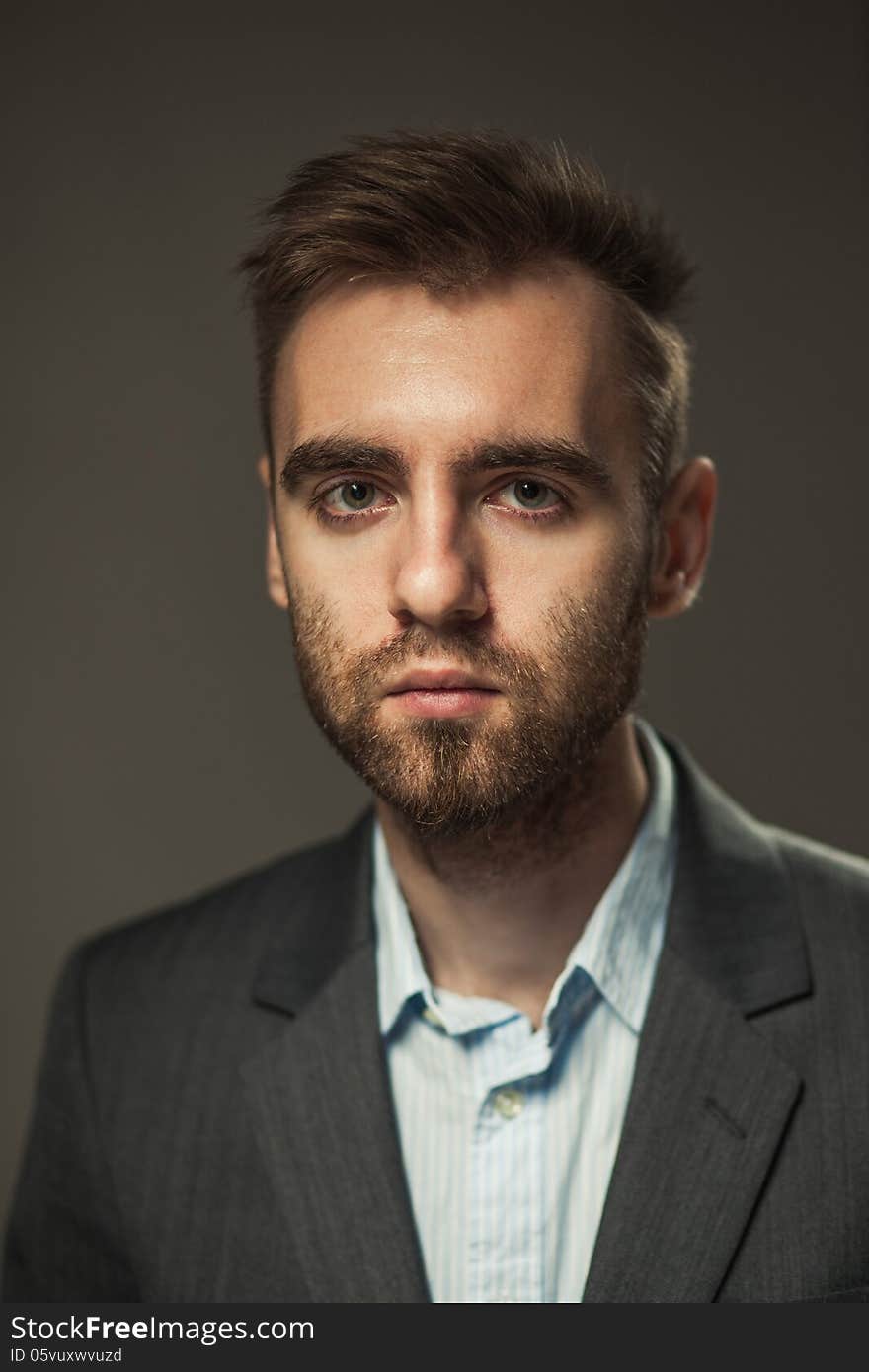 Young Businessman On A Dark Background