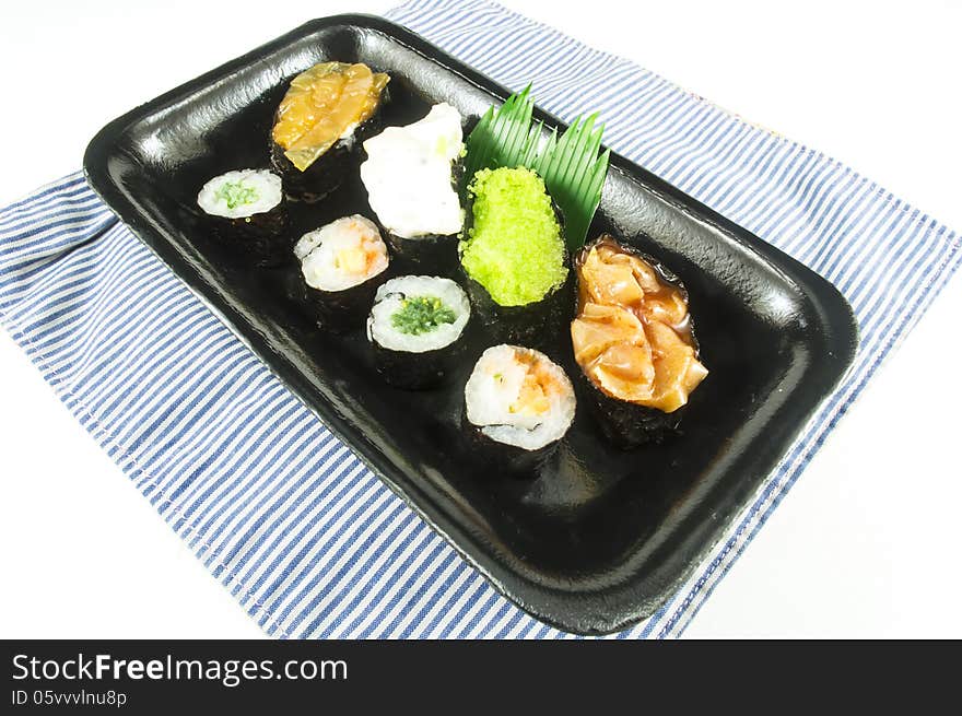 Sushi and rolls on white isolate