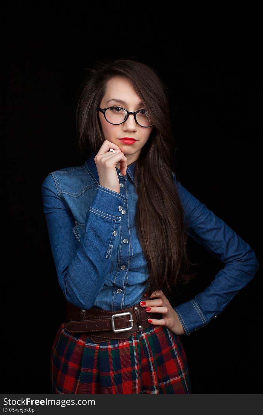 Young woman on a dark background