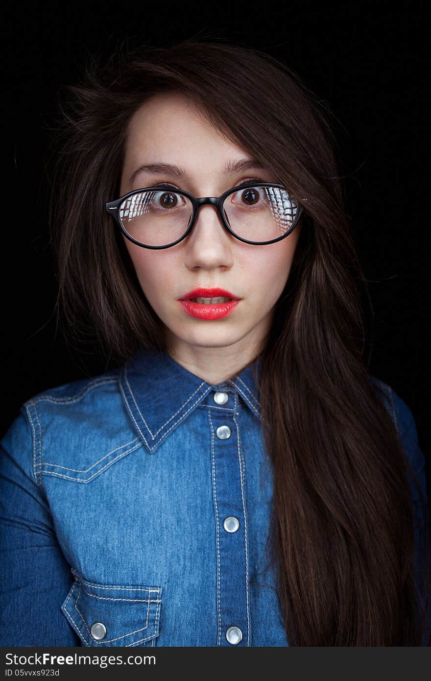 Young woman on a dark background