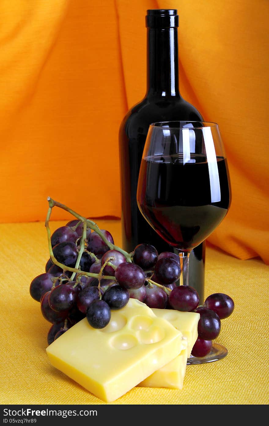 Emmental Cheese With Wine And Grapes