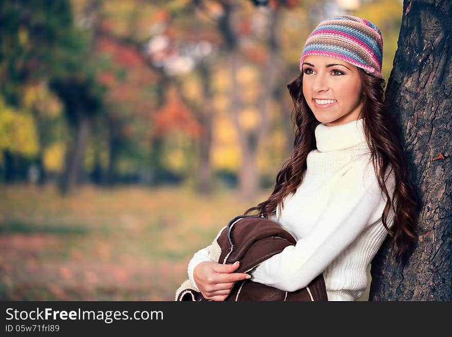 Fashionable woman in autumn park