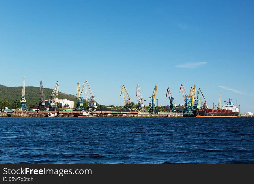 Port with cranes and ships, cargo ship