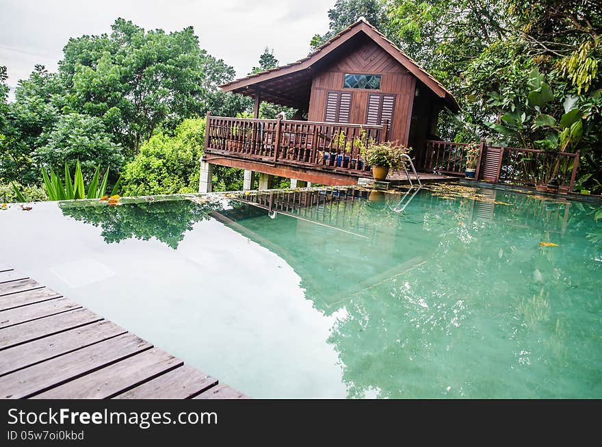 Wooden tropical resort with a pool