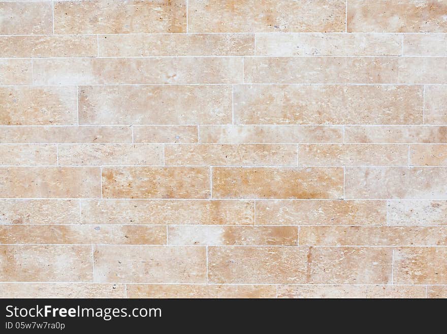 A marble wall is built of marble and mortar. A marble wall is built of marble and mortar