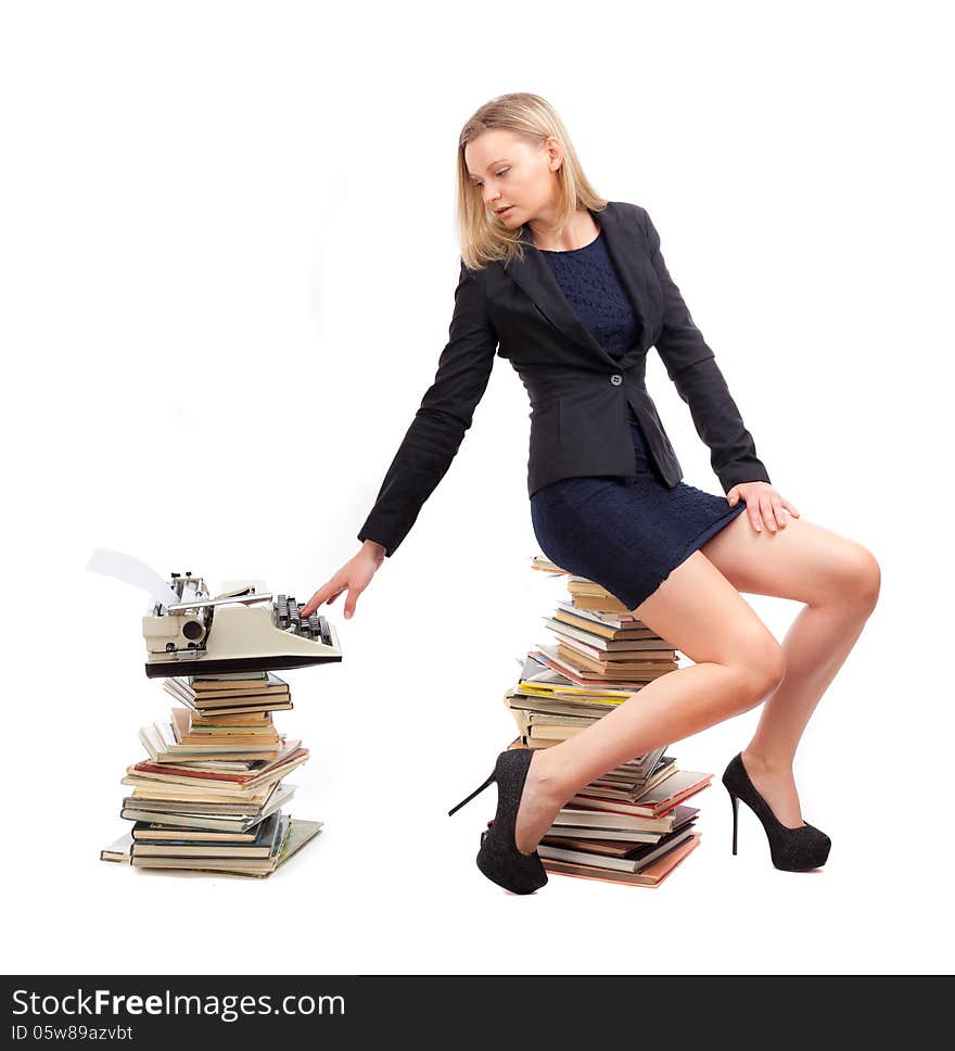 Business-woman is working with a typewriter on a white background.