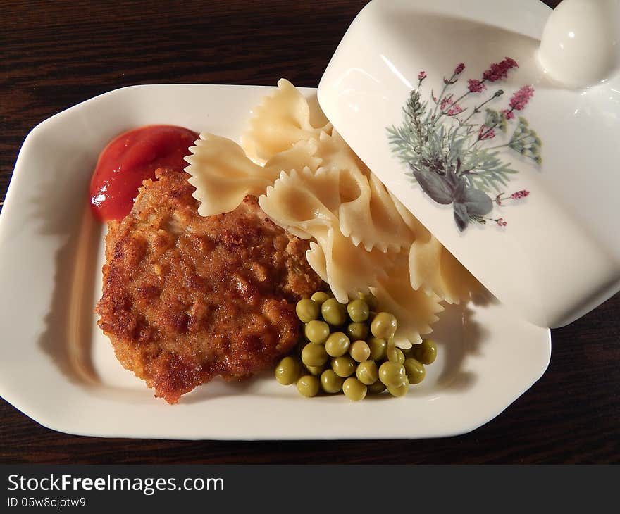 Noodles and pork chop in a beautiful dish