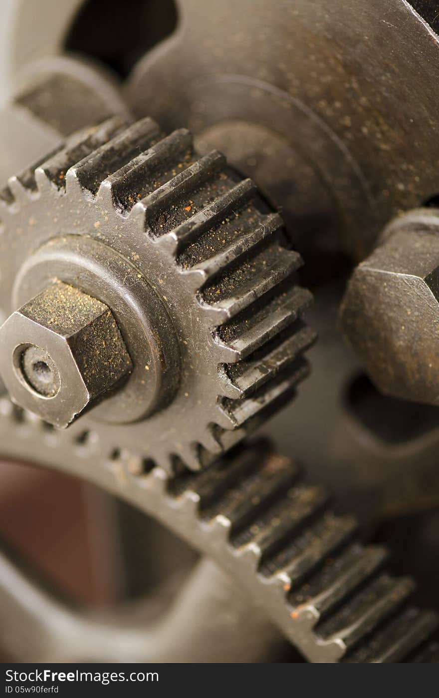 An rusted iron gear of an antiquated steam machine. An rusted iron gear of an antiquated steam machine