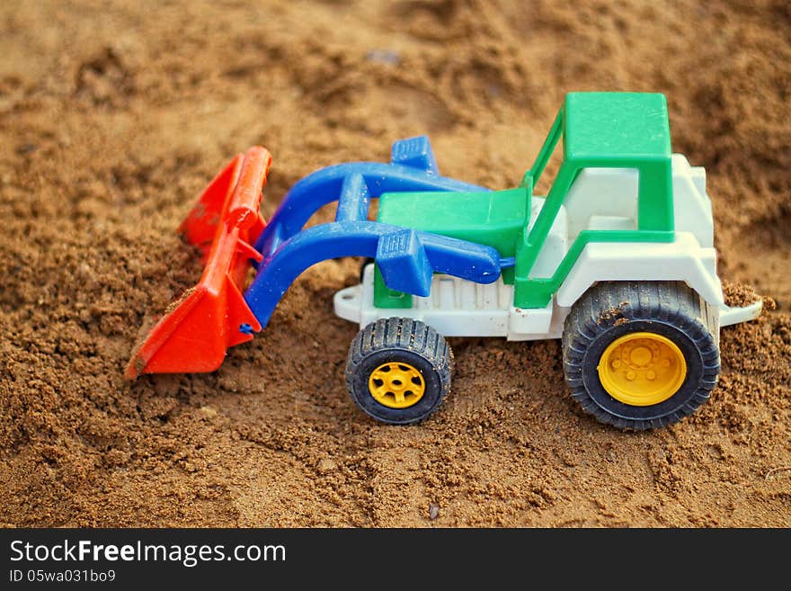 Toy Tractor in the sandbox