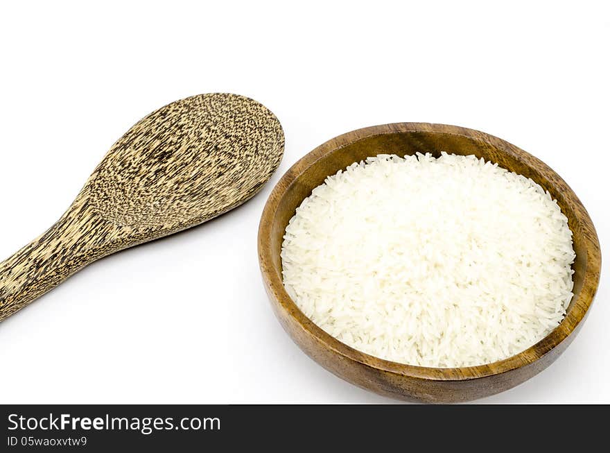 Rice on wood bowl isolated on white background