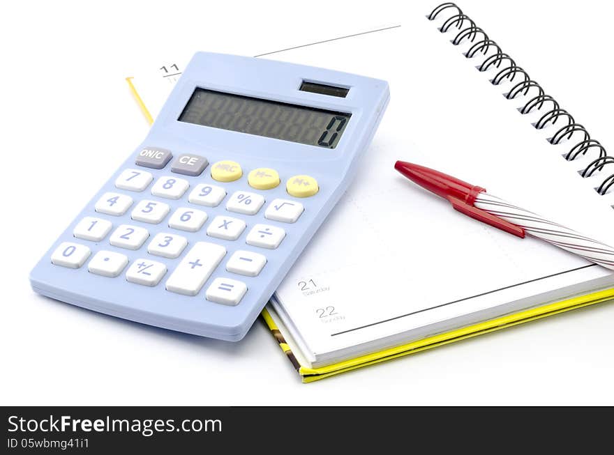 Calculator  With Notebook And Red Pen Isolated On White