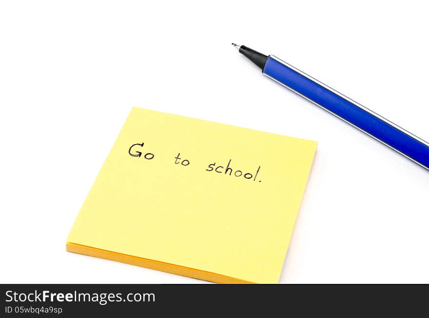 Go to school word on orange post it with blue pen isolated on white backround