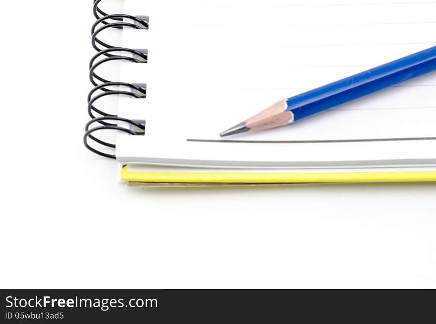 Notebook And Blue Pencil Isolated On White