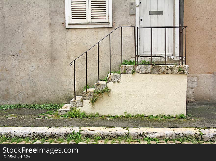 Old stone steps, wooden door and window