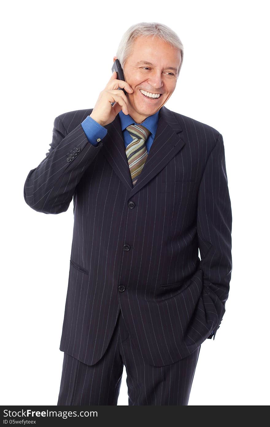 Image of a senior businessman talking on cell phone and smiling, isolated on white. Image of a senior businessman talking on cell phone and smiling, isolated on white