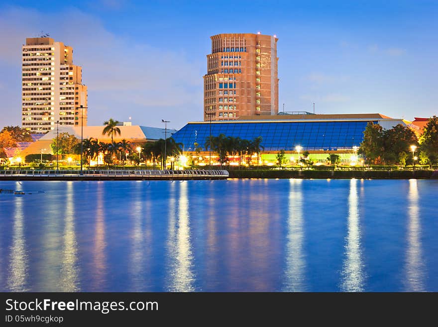 Night cityscape, Meeting hall in Thailand at dusk. View from public park.