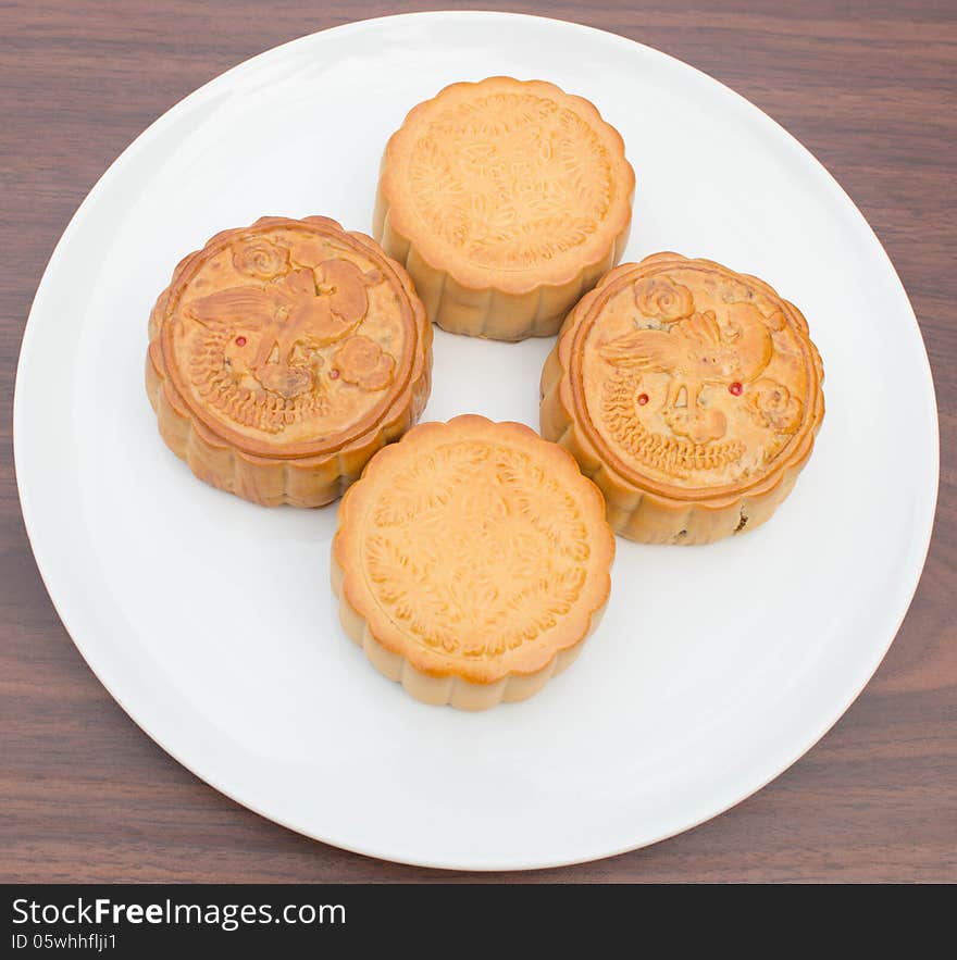 Mooncakes placed on a white plate. Mooncakes placed on a white plate.