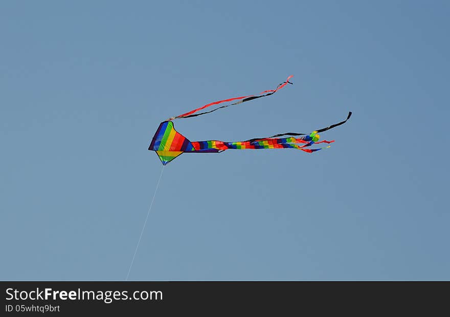 A colourful kite photographed against the summer sky. A colourful kite photographed against the summer sky